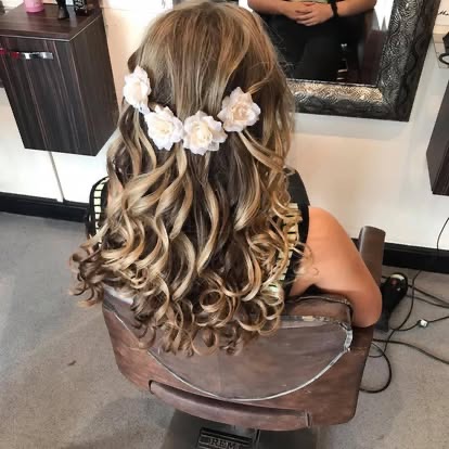Half-up curls finished with white flowers